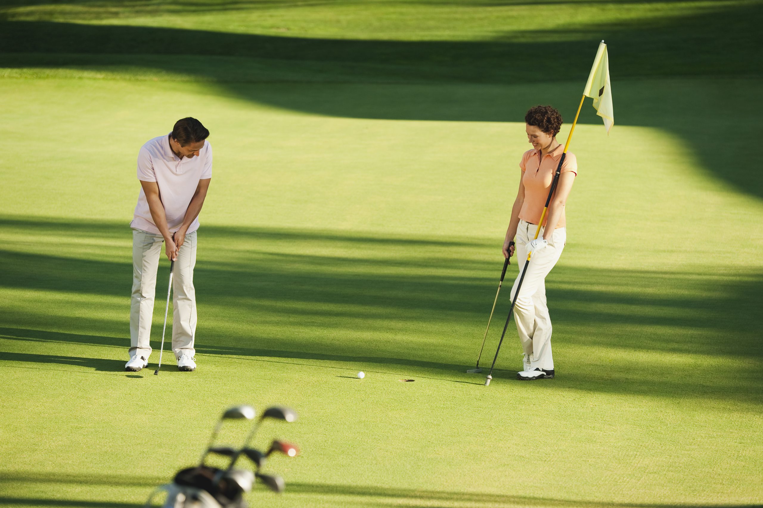 couple playing golf